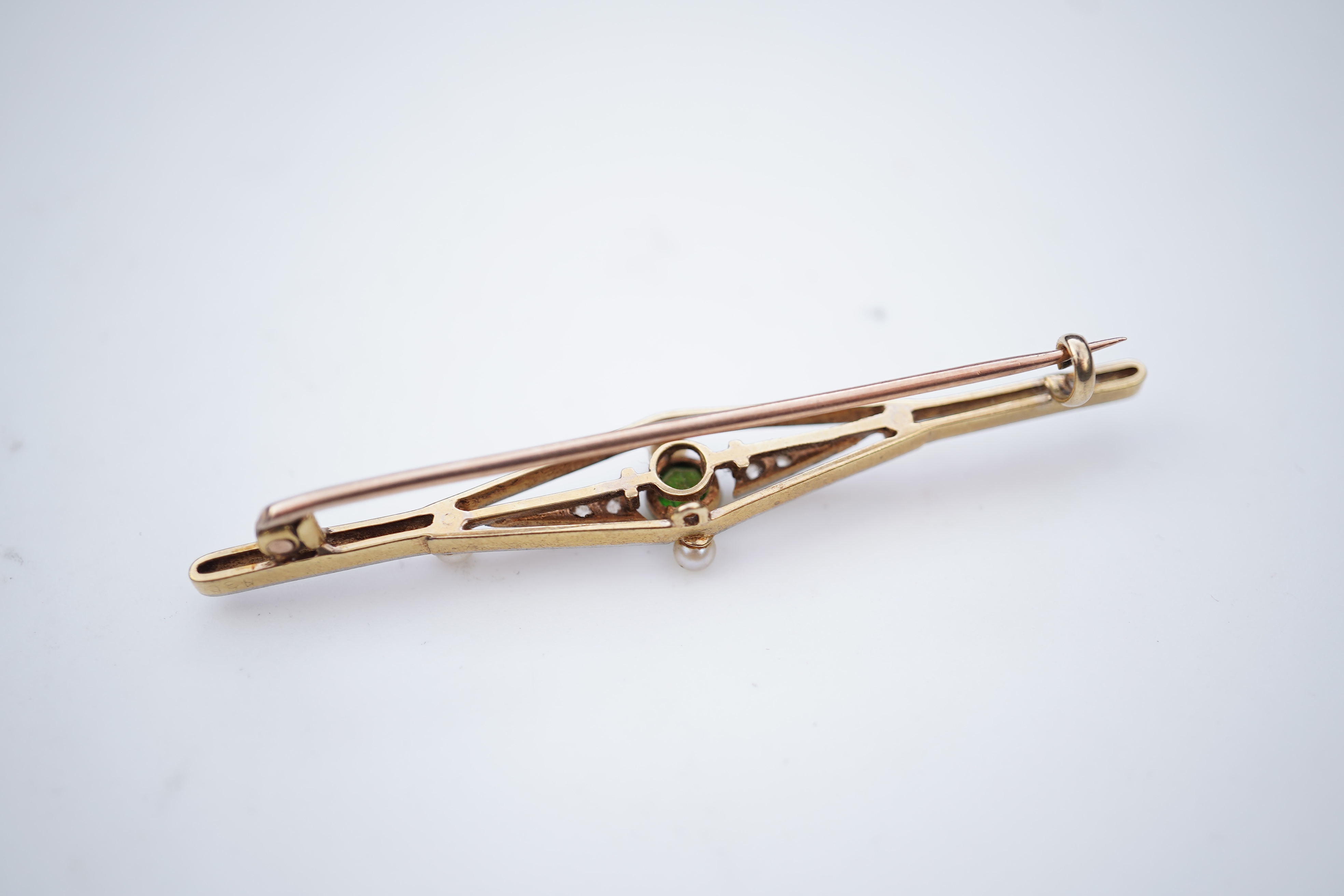 Four gold and gem-set bar brooches, early 20th century